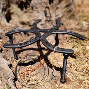 Handcrafted horseshoe potjie stand trivet used for cooking over a fire