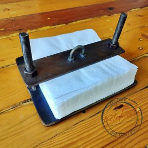 Handcrafted metal serviette holder for storing your napkins without them blowing away